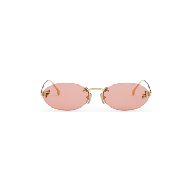 "Gafas Fendi con montura dorada y lentes ovaladas rosadas. Un toque de feminidad y sofisticación."
